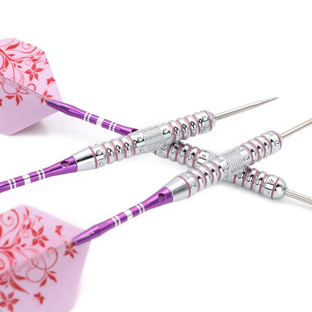 Close-up of silver steel tip darts with purple shafts and pink floral flights