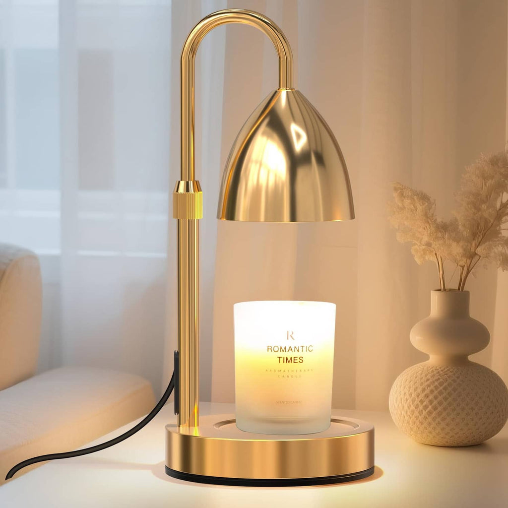 Gold candle warmer lamp with arched handle and reflective metal shade on round base stand