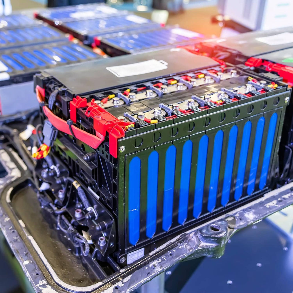 Super capacitor modules installed on a circuit board with rows of blue capacitor cells