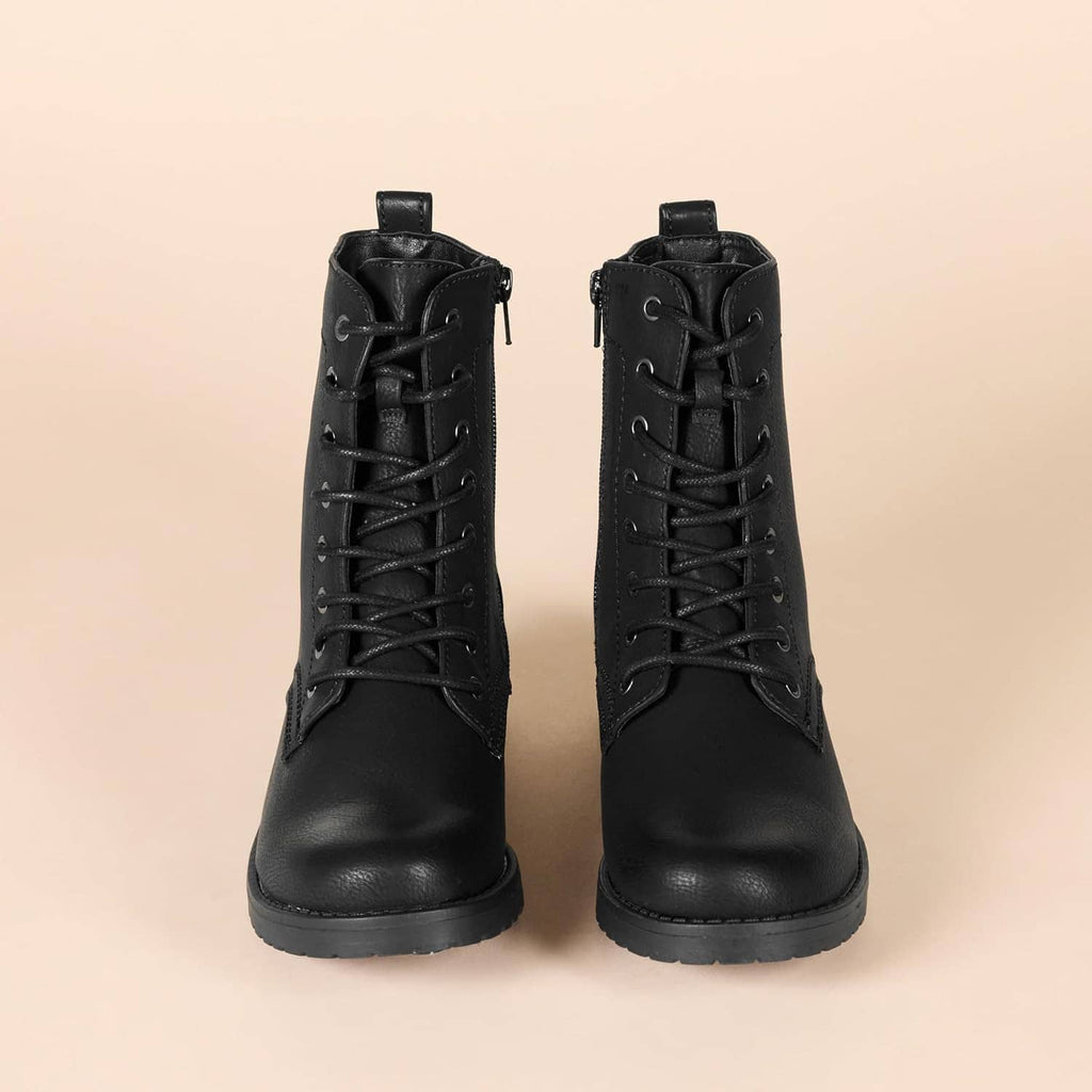 Pair of black lace-up combat boots with treaded lug soles