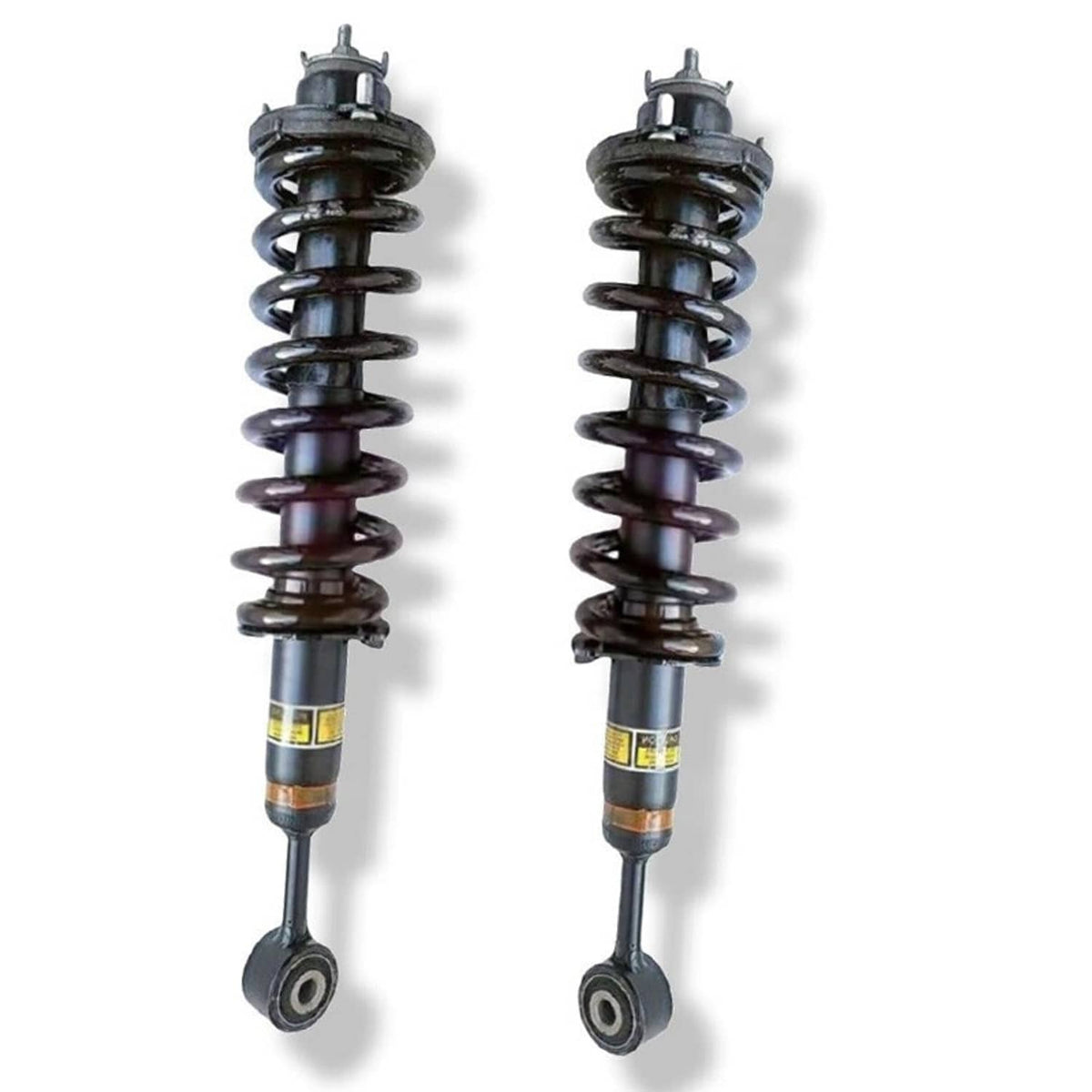 Front shock absorber strut assembly pair with black springs and yellow label bands