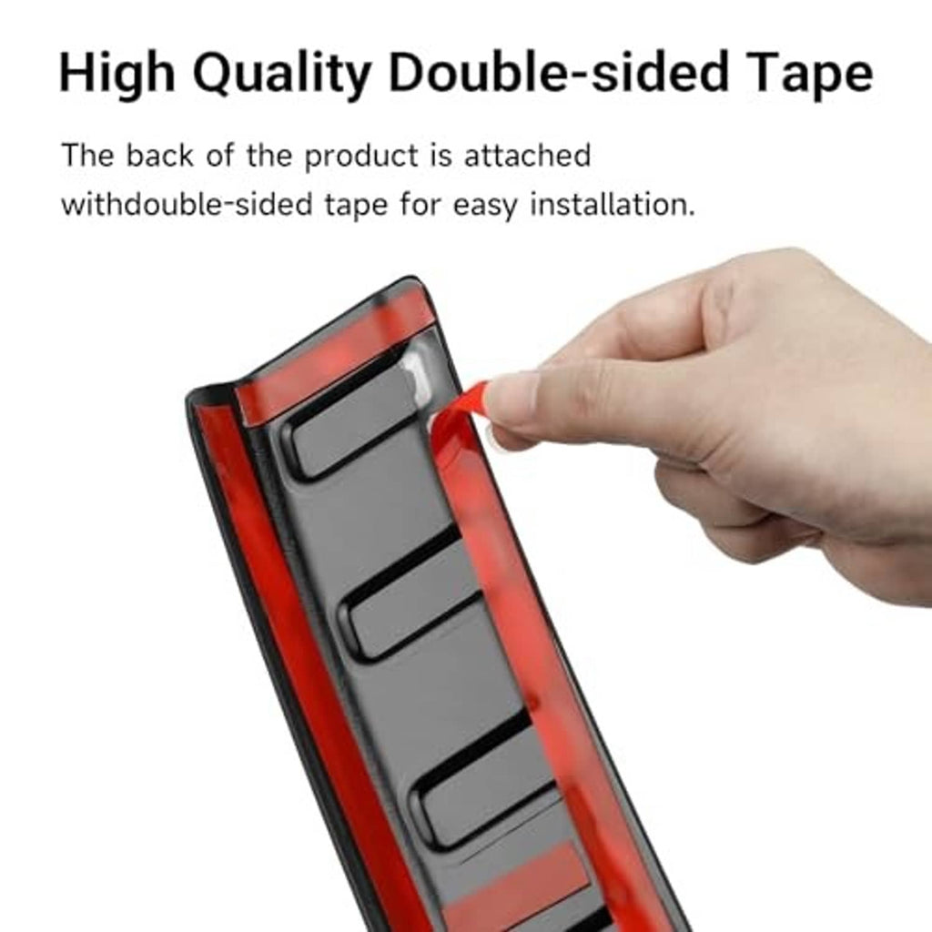 Black rear bumper protector strip with double-sided tape backing for mounting
