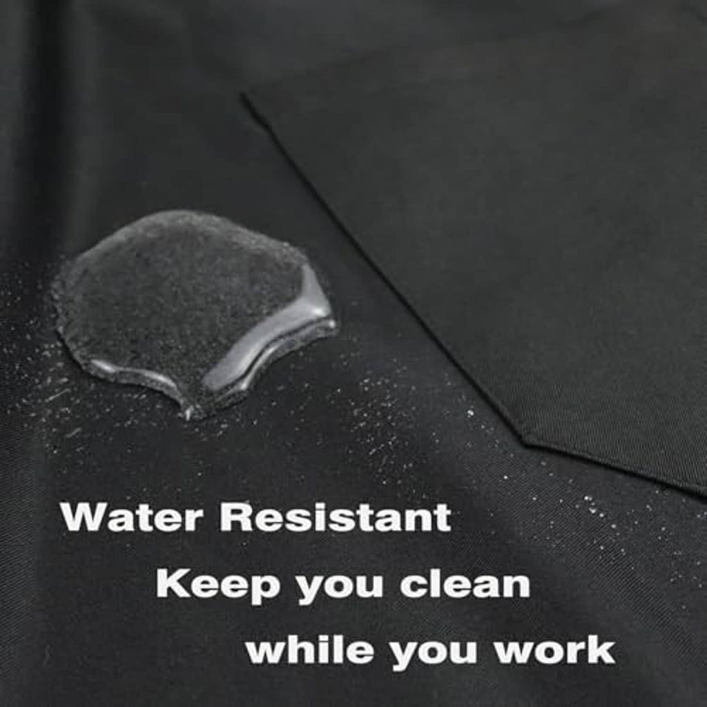 Black water-resistant apron fabric close-up with water droplets on surface