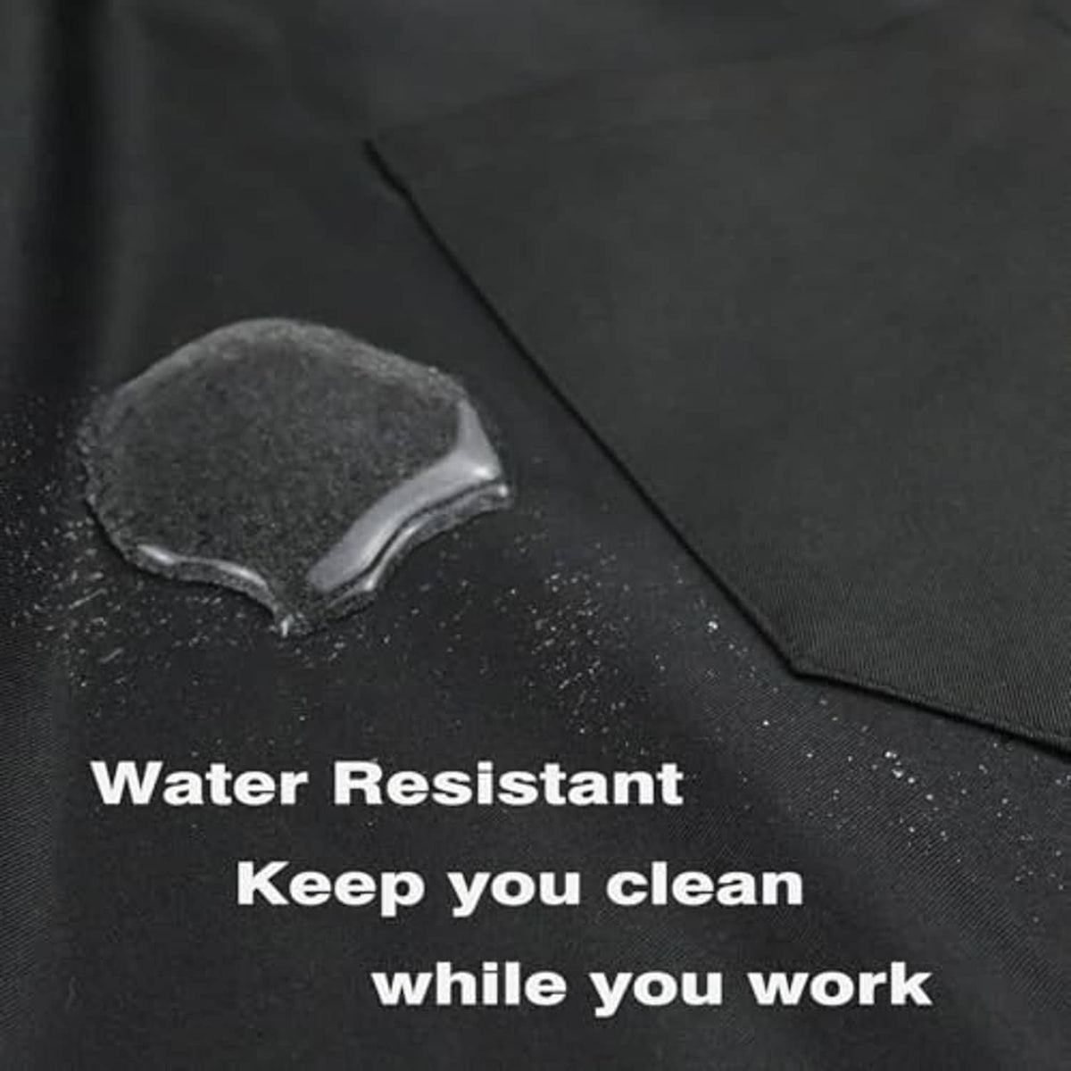 Black water-resistant apron fabric close-up with water droplets on surface