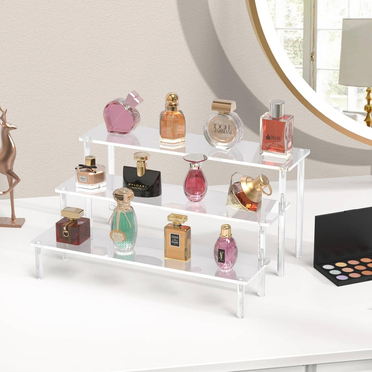 Clear acrylic 3-tier perfume display stand with multiple fragrance bottles