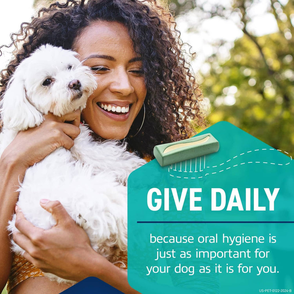 Woman holding a small white dog while a mint-green chew is shown in the foreground