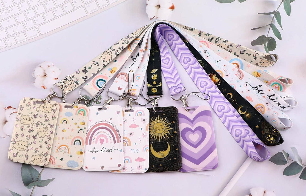 Assorted ID badge holders on lanyards, including purple heart-pattern designs