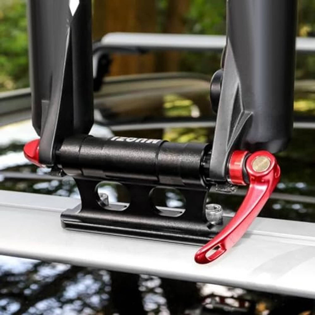 Red bike fork mount secured on car roof rack crossbar with black base