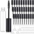 Empty mascara tube set with black wand brushes, clear bottle, and spare caps