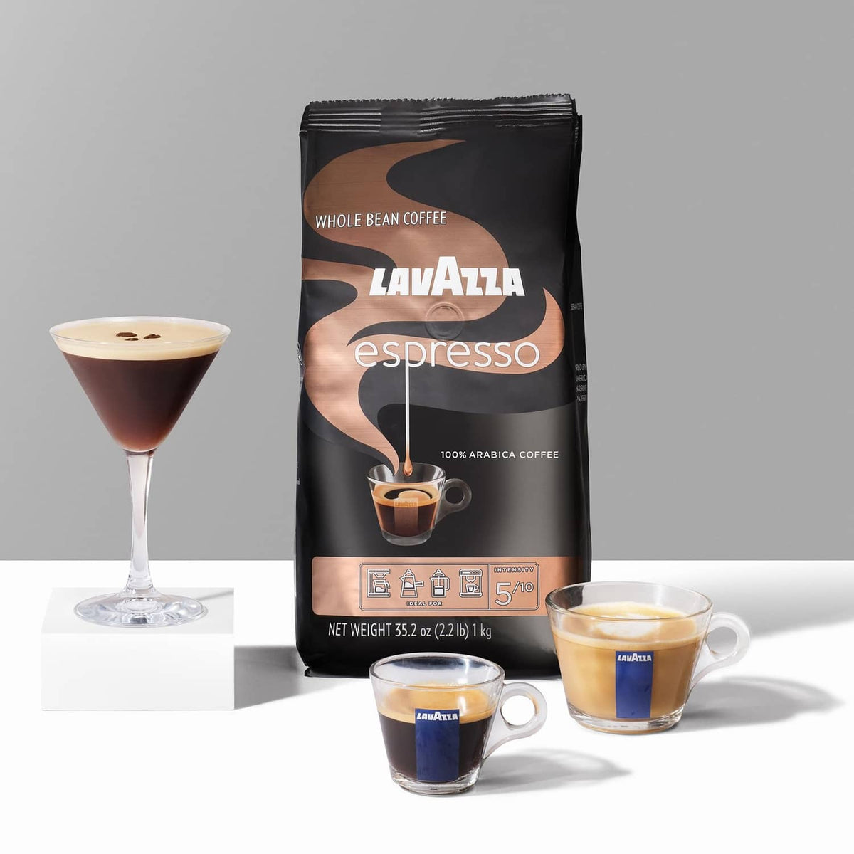 Lavazza espresso whole bean coffee bag with two espresso cups and coffee drinks
