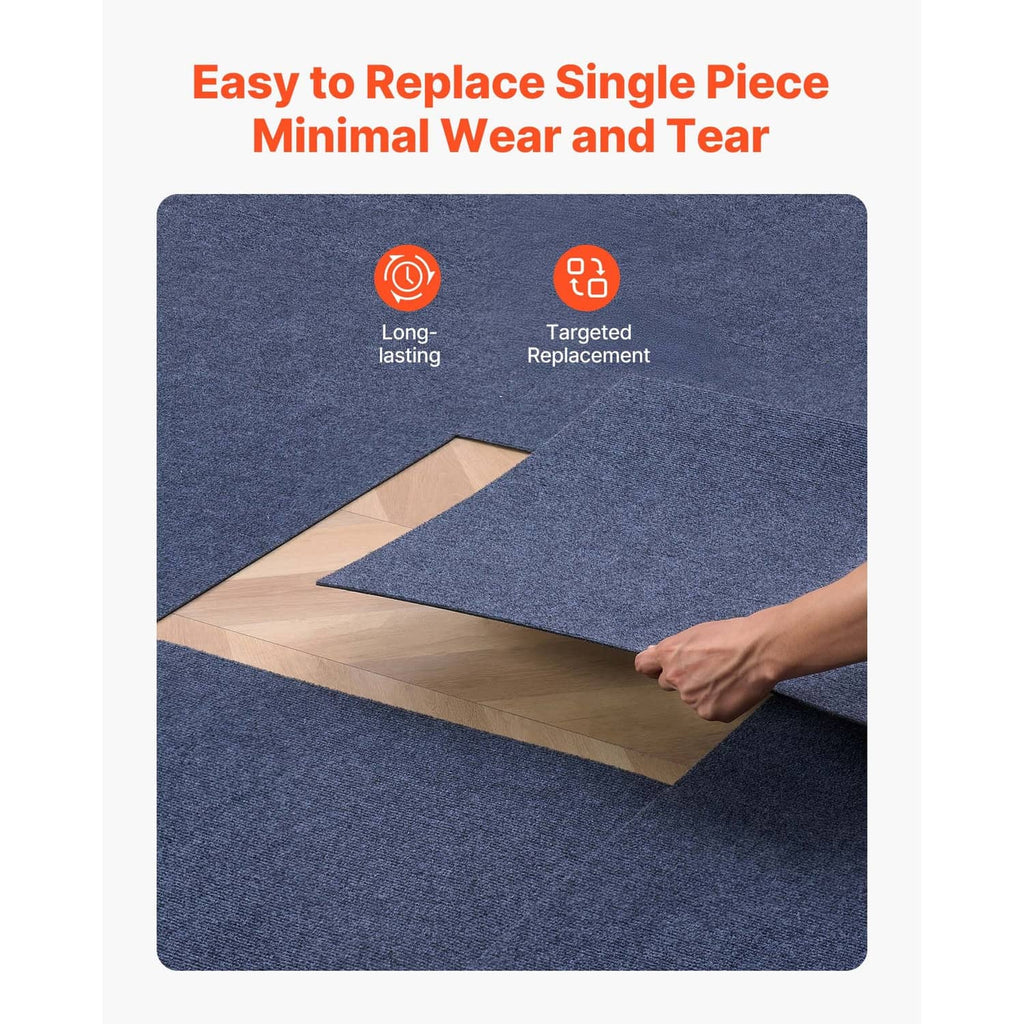 Gray self-adhesive carpet tile being slid into place on the floor