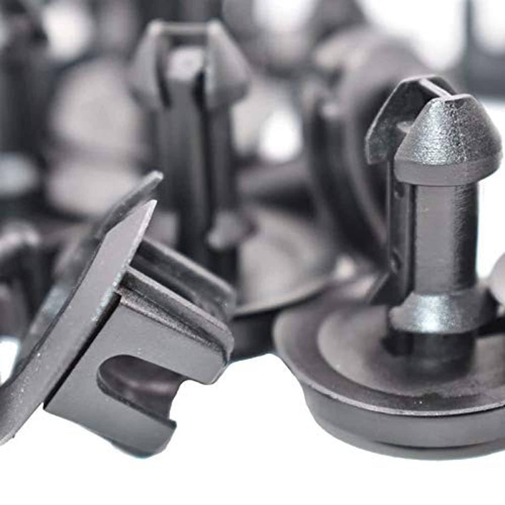 Close-up of dark gray front air deflector retainer clips and grommets