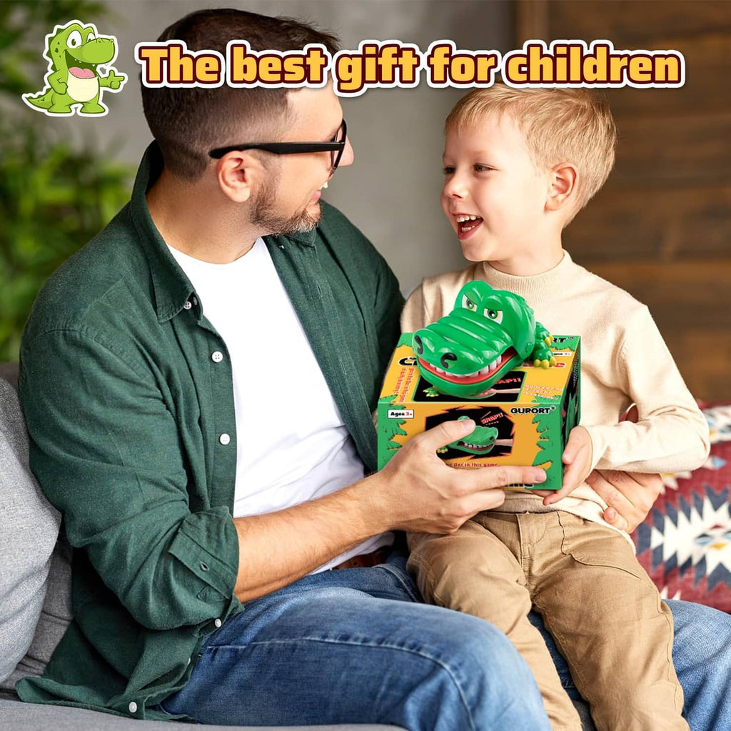 Kids holding a crocodile tooth game box and green crocodile toy