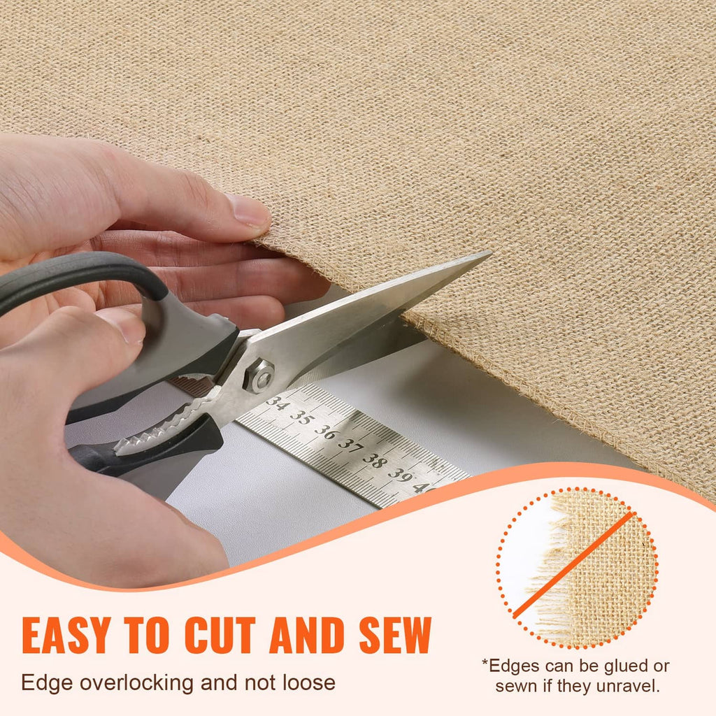 Natural burlap fabric being cut with scissors along the fabric edge