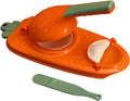 Orange and green dumpling press mold with curved handle and green scraper tool