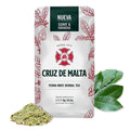 Yerba mate herbal tea pouch with green leaves pile and fresh green leaf sprig
