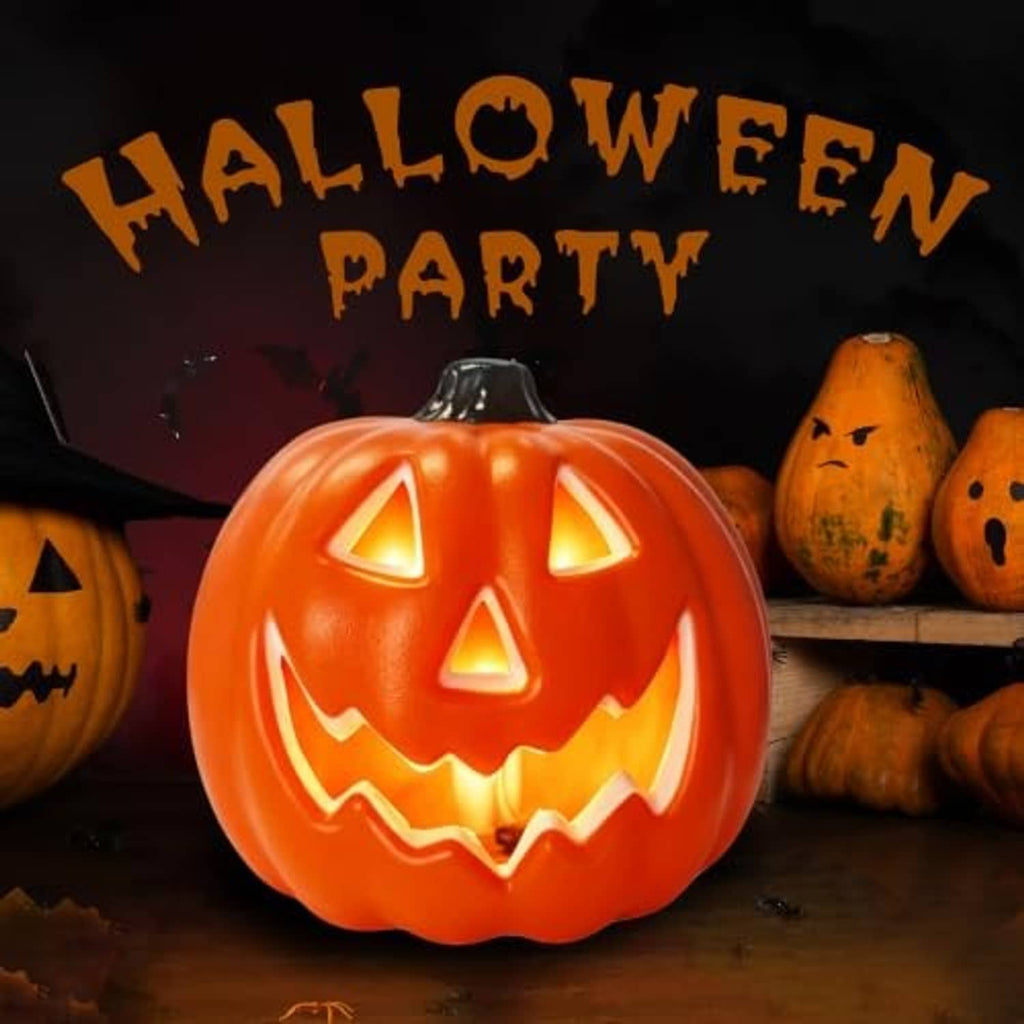 Glowing orange LED jack-o-lantern pumpkin with carved eyes and toothy jack mouth
