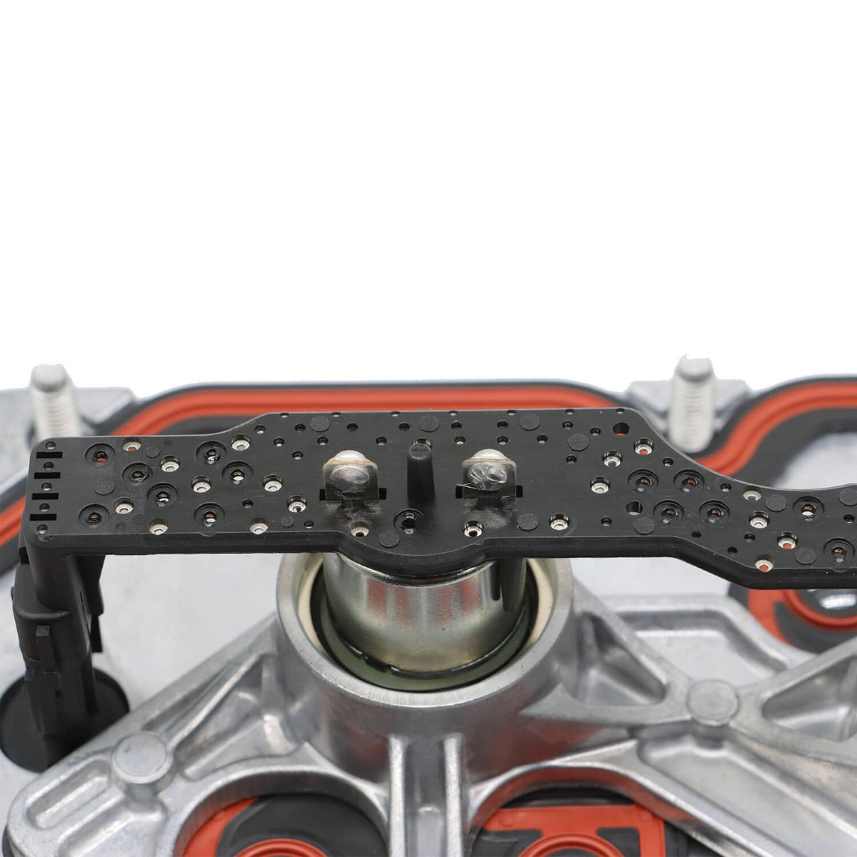 Valve cover interior with black component rail and round oil passages
