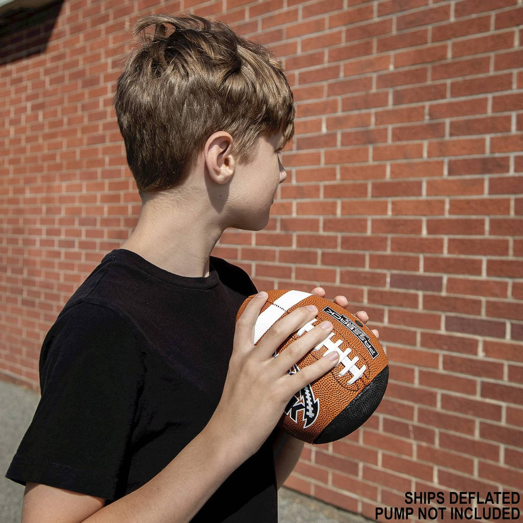 Boy holding an orange youth composite football with white laces and logo