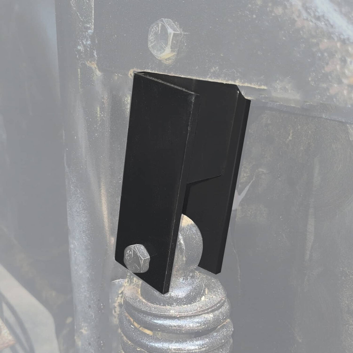 Installed black steel lift spacer bracket on golf cart suspension/axle area