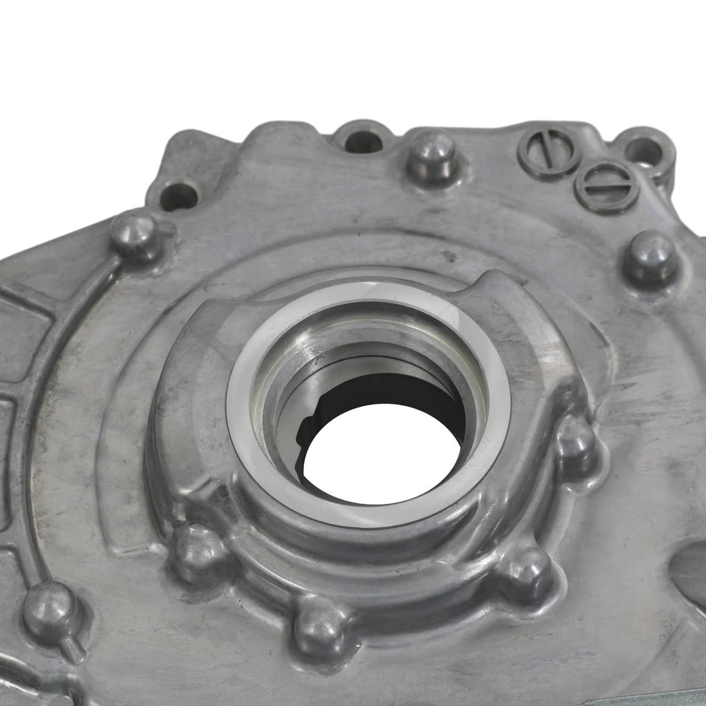 Oil pump housing with large circular opening and surrounding retaining bolts