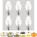Set of 6 E12 replacement bulbs with clear glass and metal screw base, amber glow