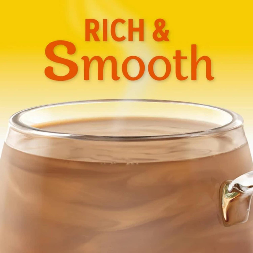 Coffee-mate Zero Sugar Hazelnut creamer in glass mug labeled “Rich & Smooth”