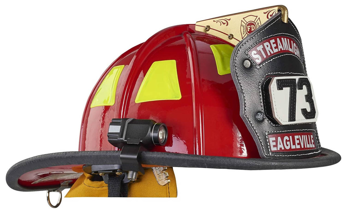 Clip-on flashlight mounted on a red firefighter helmet, front LED lens visible