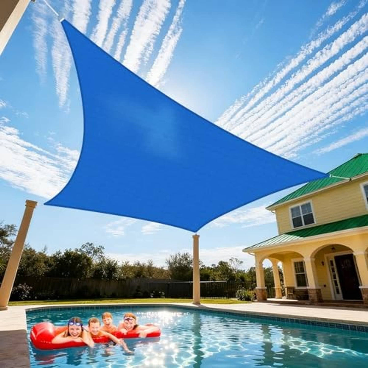 Blue rectangular sun shade sail stretched between posts over a swimming pool area.