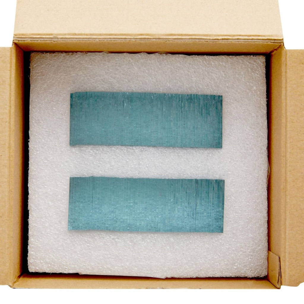 Small square glass mirror tiles packed in a box with protective foam insert