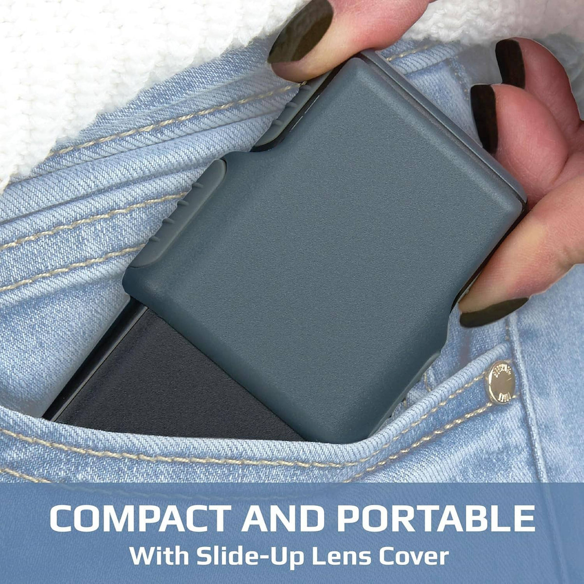 Dark gray magnifier tucked into blue denim pocket with slide-up lens cover