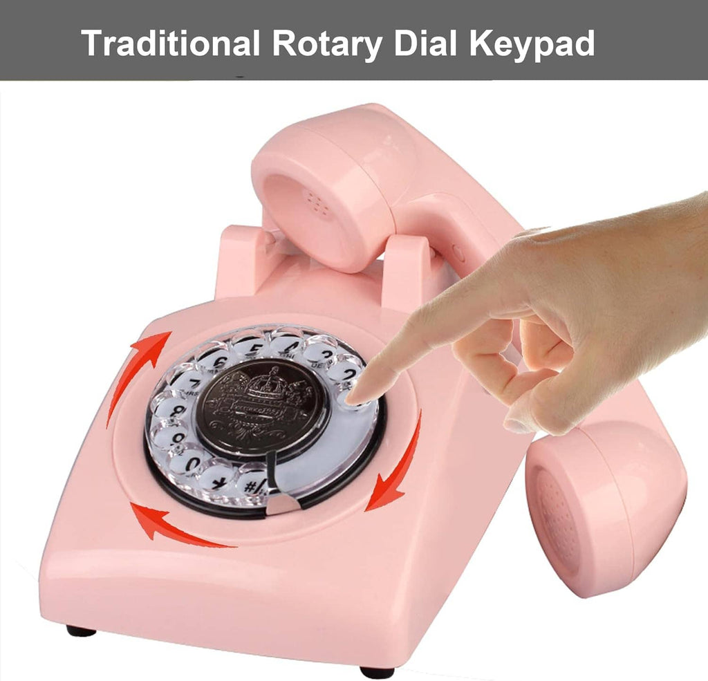 Pink corded rotary dial telephone with finger pressing the rotating dial