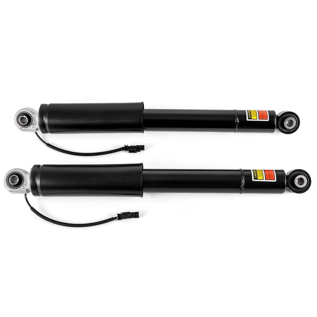 Black rear shock strut pair with bottom eye mounts and attached wiring harness