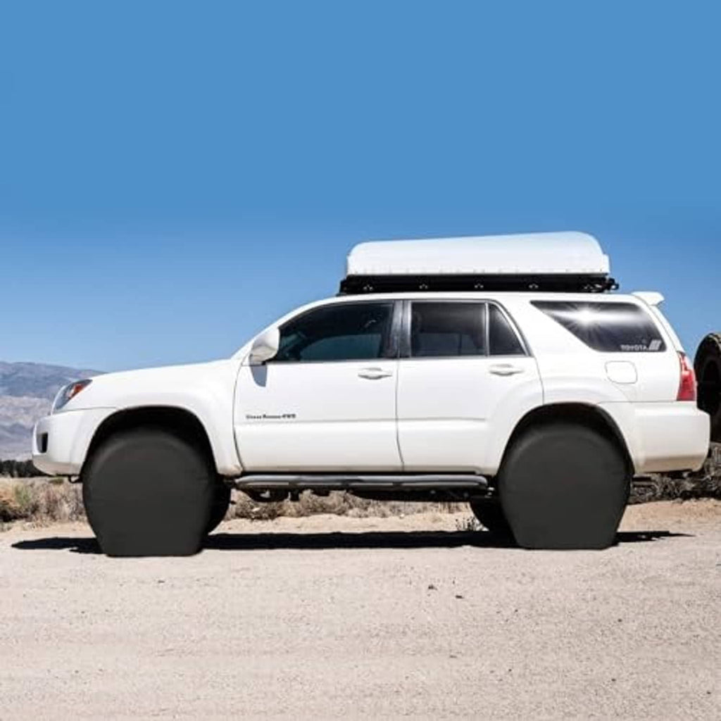 Black tire covers over the rear wheels on an SUV