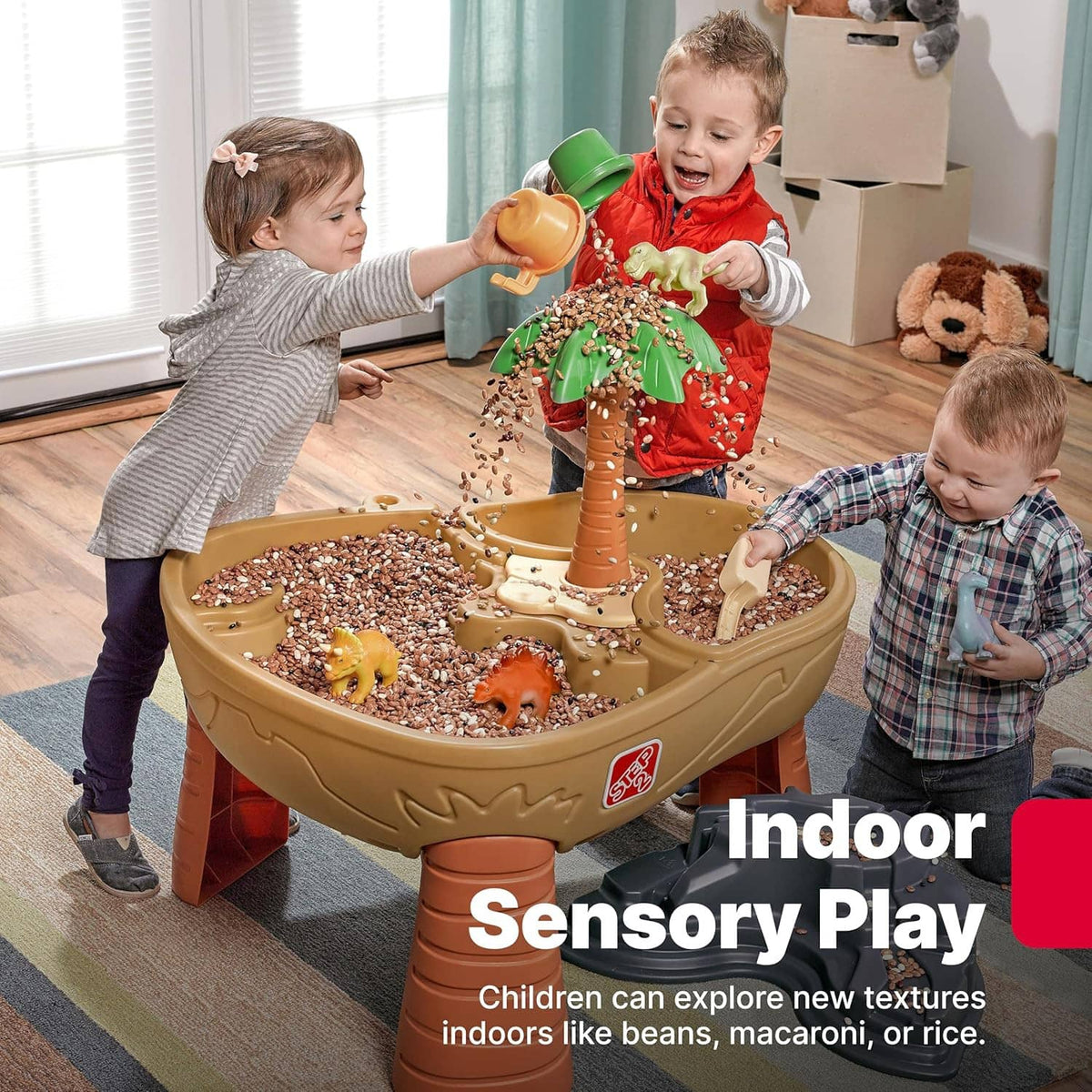 Kids dinosaur sand and water play table for indoor sensory play with tan basin and palm tree