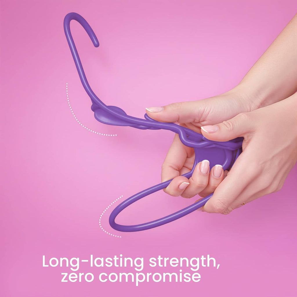 Purple plastic clothes hanger held by hands, smooth curved frame and hook