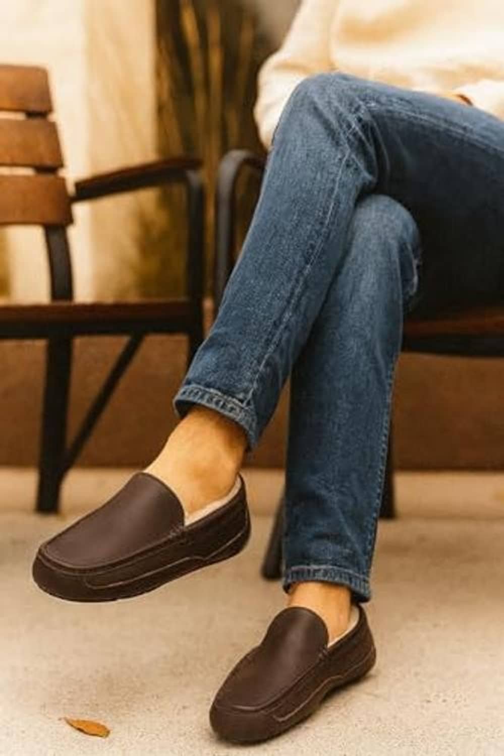 Men's dark brown leather slip-on house shoes on feet with plush lining