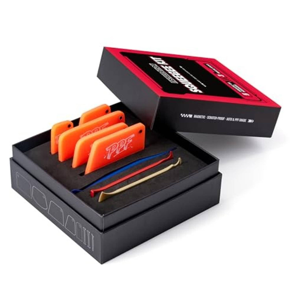 Open kit box showing orange PPF squeegees, blue applicator, and beige scraper.