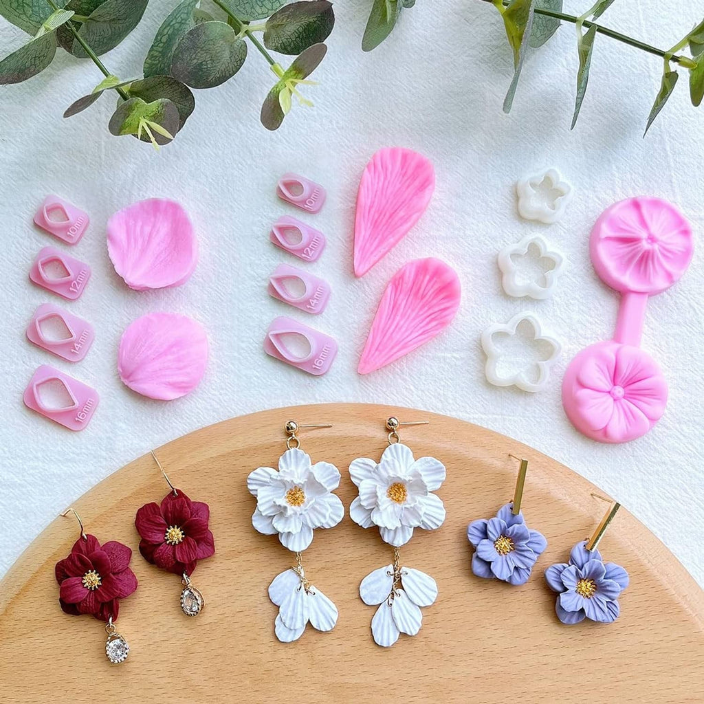 Flower petal polymer clay earring set display with pink, white, and red flower designs