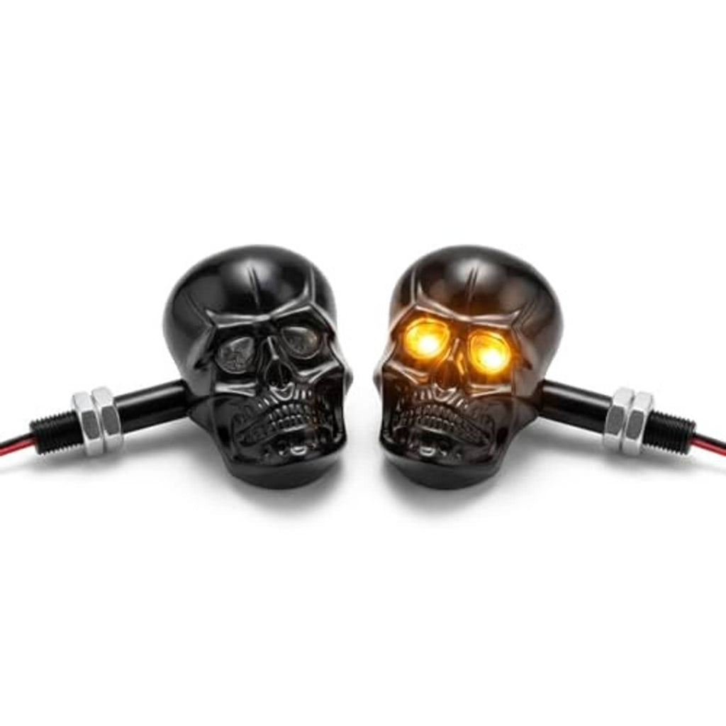 Black skull LED amber turn signal pair with glowing eyes and chrome mounting screws