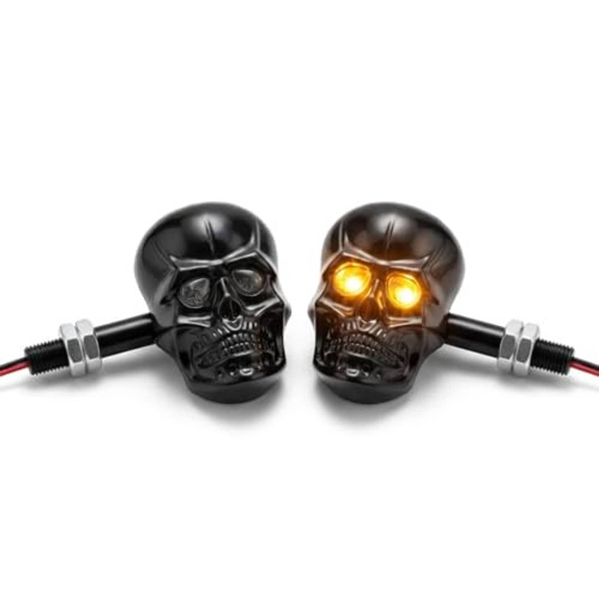 Black skull LED amber turn signal pair with glowing eyes and chrome mounting screws