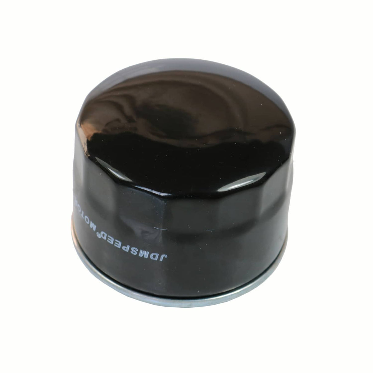 Close-up of black oil filter top with silver rim and printed branding