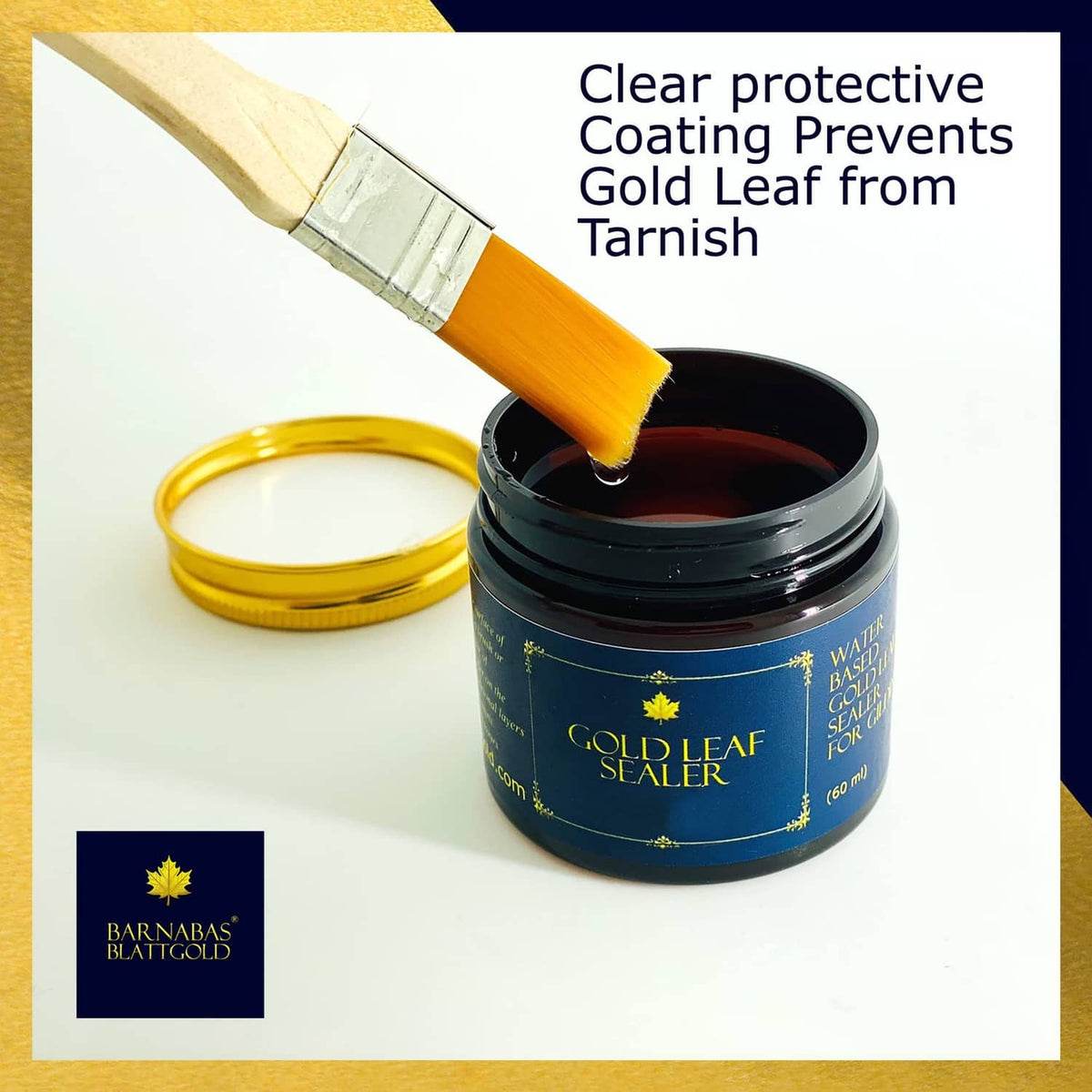 Gold leaf sealer jar with orange brush applying protective clear coating; lid open