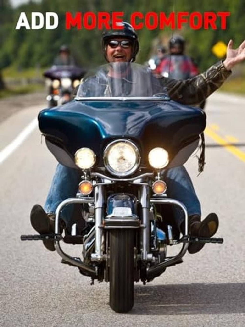 Pair of black highway footpegs mounted on a touring motorcycle front frame area