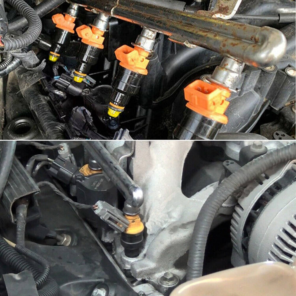 Fuel injectors with orange electrical connectors installed in an engine bay