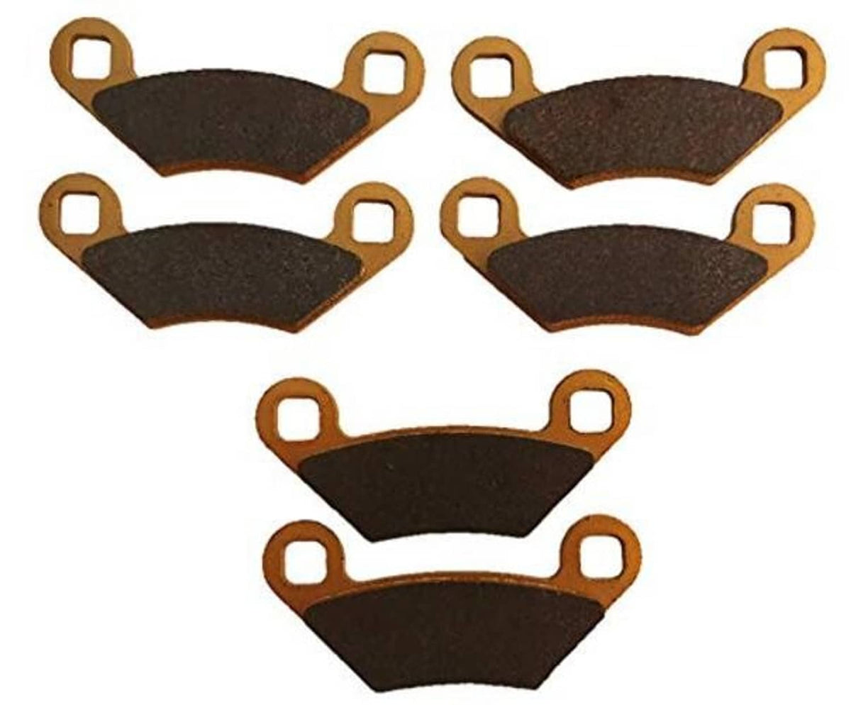 Ceramic brake pads, dark gray friction surfaces with gold mounting ears