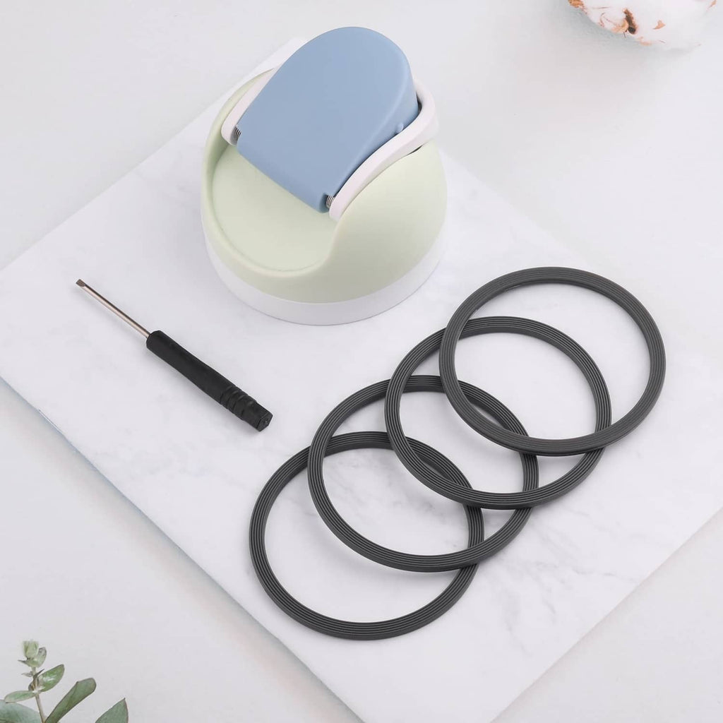 Gray seal ring set beside a bottle lid and small tool for installation