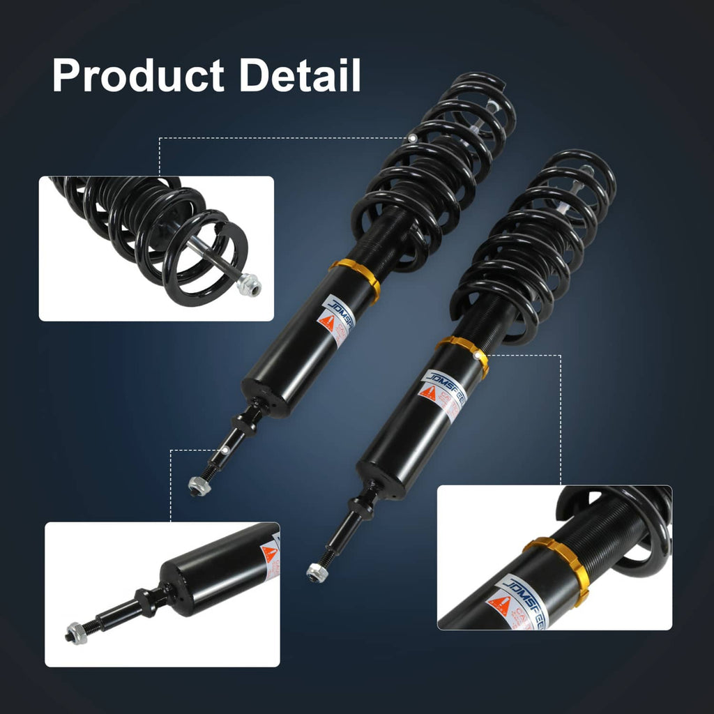 Close-up of coilover shocks with black coil springs and gold adjustment collars