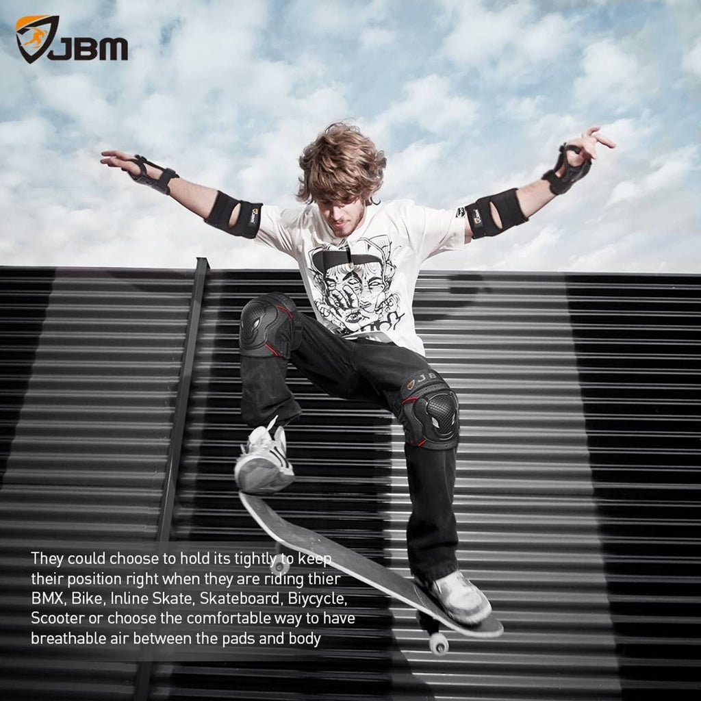 Person wearing black bike knee and elbow pads with wrist guards during a jump pose.