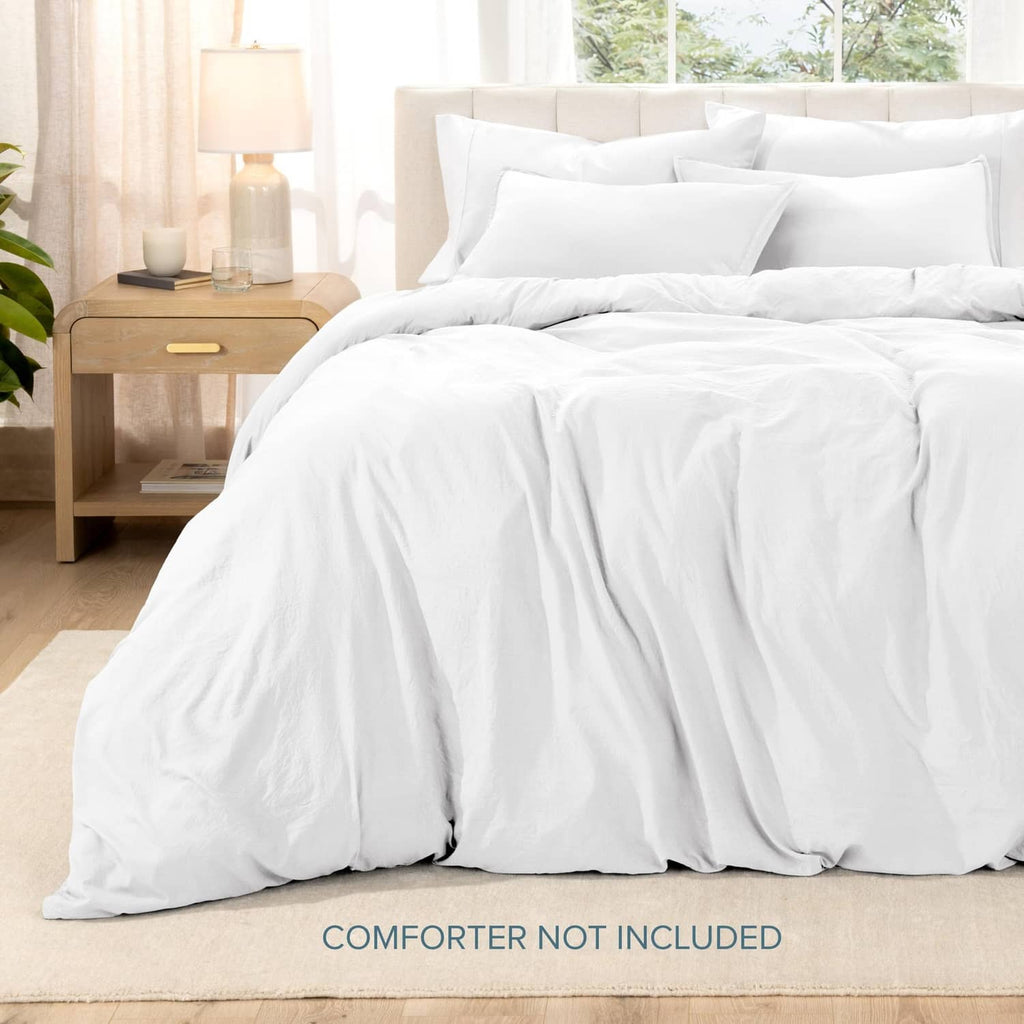 White queen duvet cover set with pillow shams, neatly draped on bed